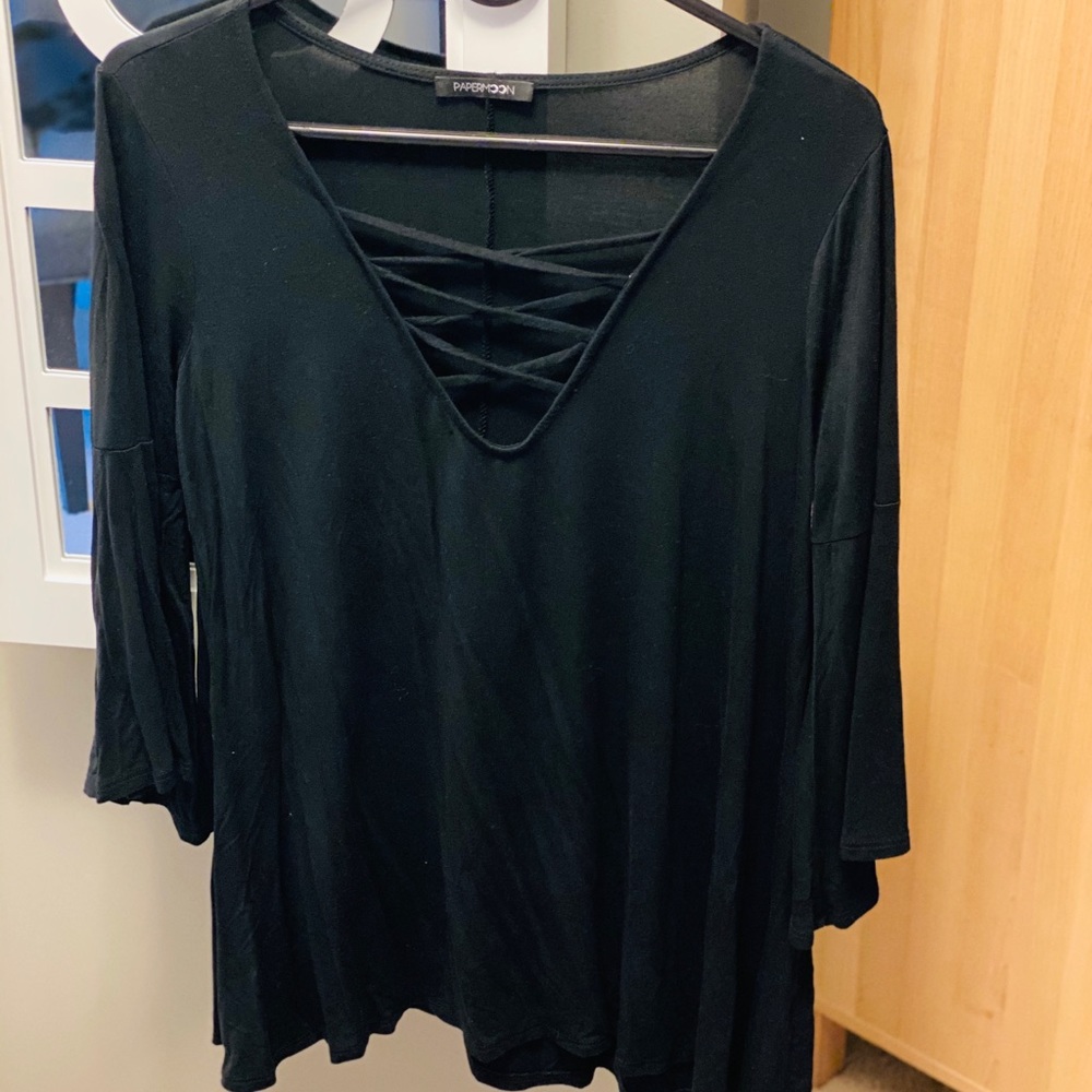 Crisscross three-quarter bell sleeve shirt